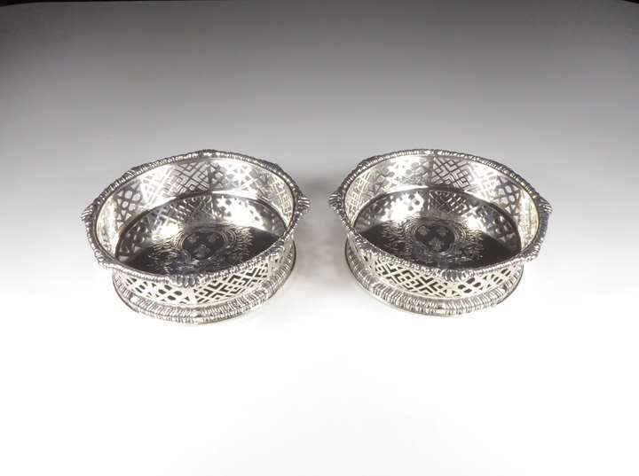 Pair of late George II silver pierced coasters
